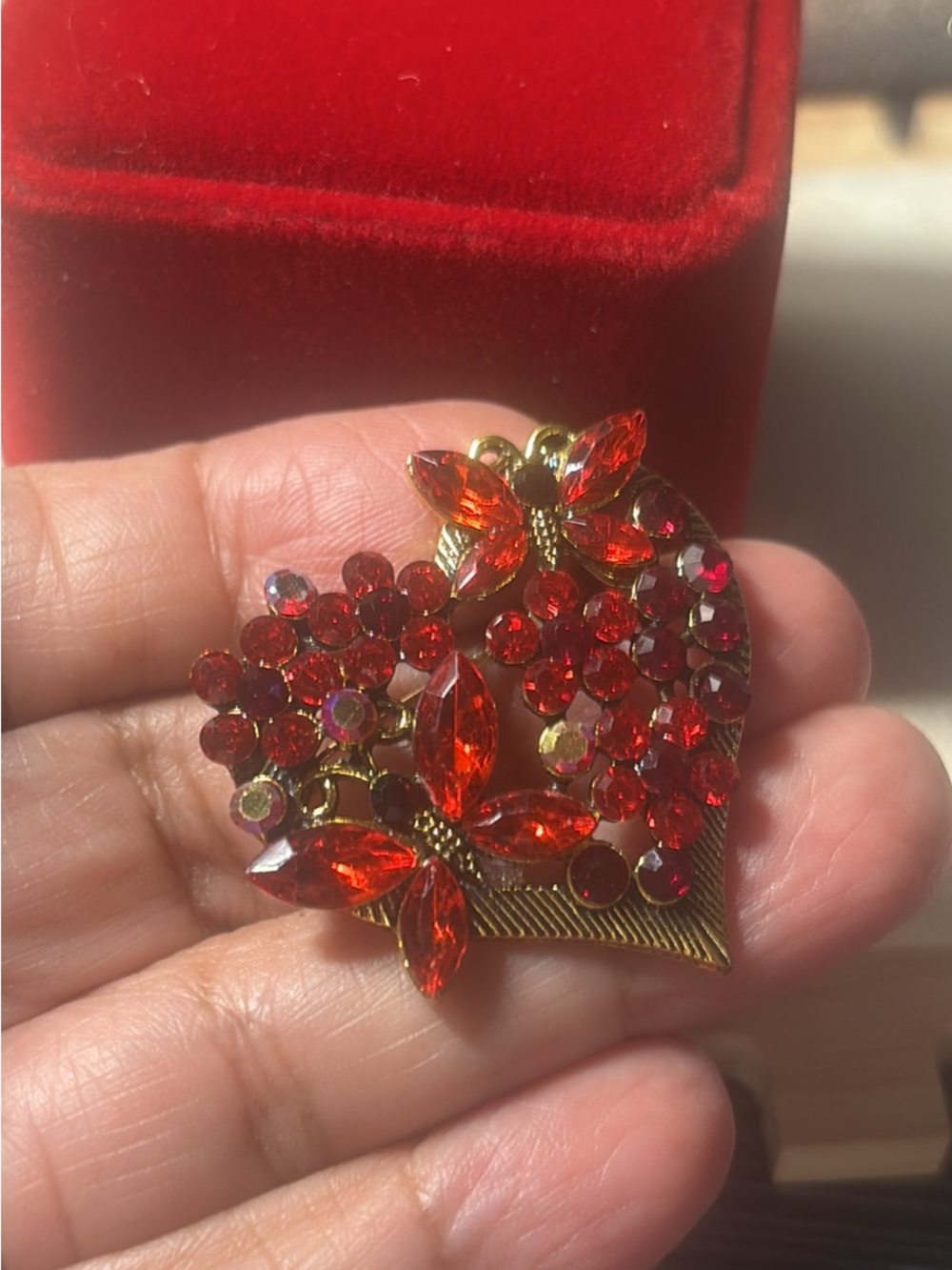 Gold-Tone Red Crystal Heart Brooch with Floral Accents